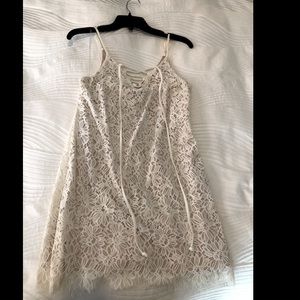 Beautiful white lace mini dress with tie neckline